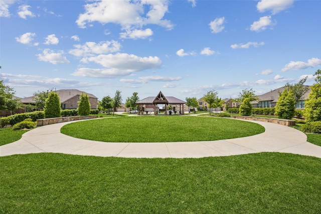 view of home's community with a gazebo and a yard