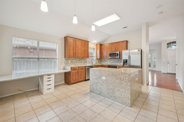 kitchen featuring decorative backsplash, visible vents, lofted ceiling, stainless steel appliances, and light tile patterned flooring