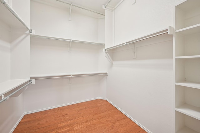 spacious closet with wood finished floors