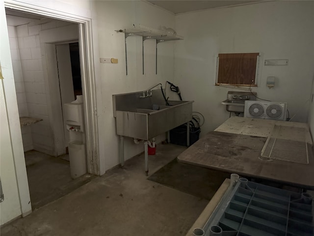 laundry area featuring a sink and washer / clothes dryer