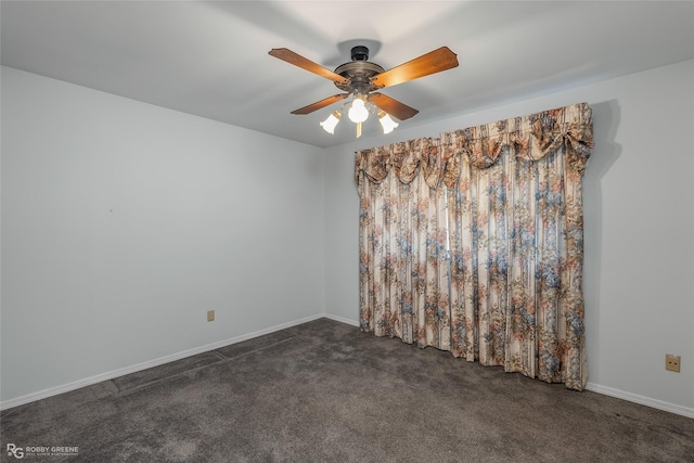 empty room with dark carpet, baseboards, and ceiling fan