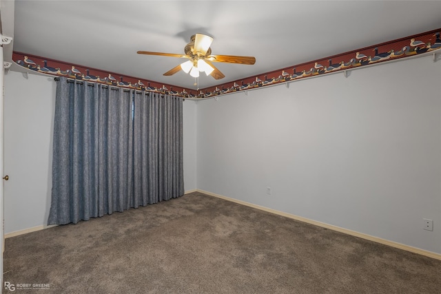 spare room featuring carpet flooring, ceiling fan, and baseboards