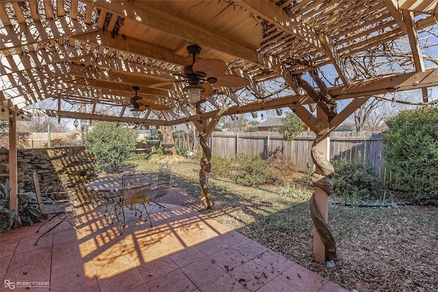 view of patio featuring a fenced backyard, ceiling fan, a pergola, and outdoor dining space