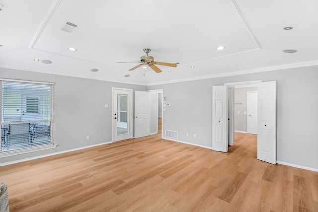 unfurnished bedroom with visible vents, light wood-style flooring, crown molding, and baseboards