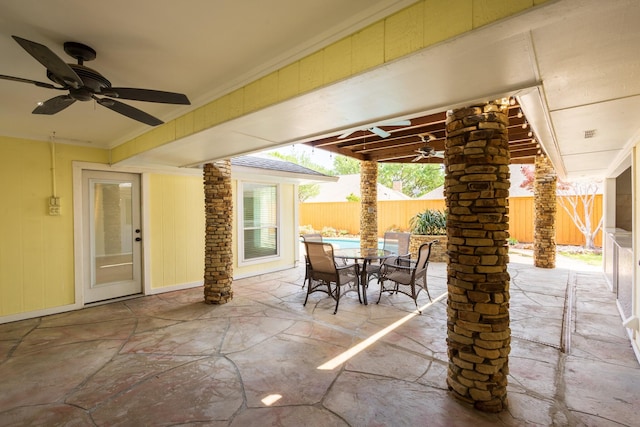 view of patio / terrace featuring a fenced backyard, ceiling fan, and outdoor dining space