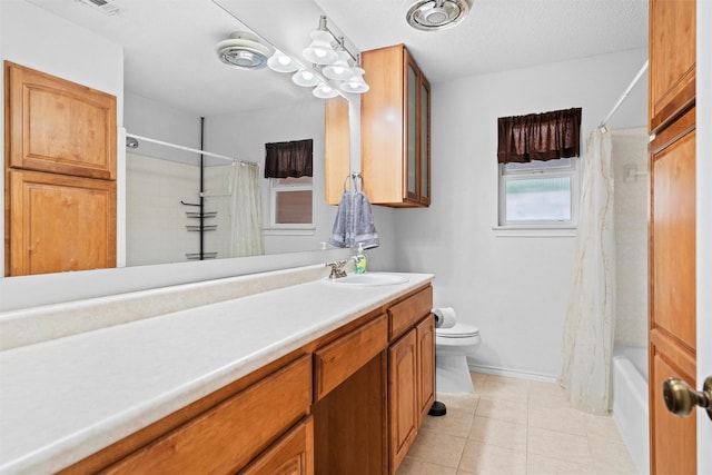 1013 Briarcreek Dr, Arlington, TX 76012 - bathroom with vanity, toilet, tile patterned floors, shower / bath combination with curtain, and baseboards