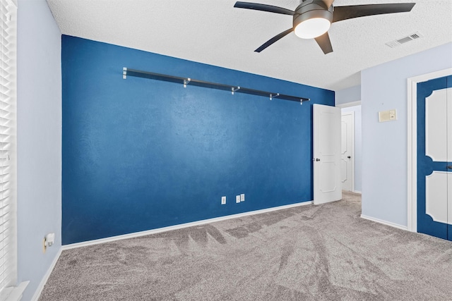1013 Briarcreek Dr, Arlington, TX 76012 - unfurnished room with carpet floors, a textured ceiling, a ceiling fan, baseboards, and visible vents