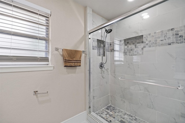 bathroom featuring a shower stall