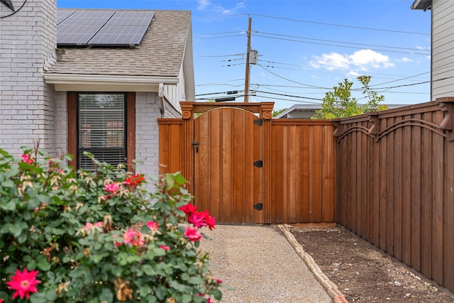 exterior space with fence and a gate