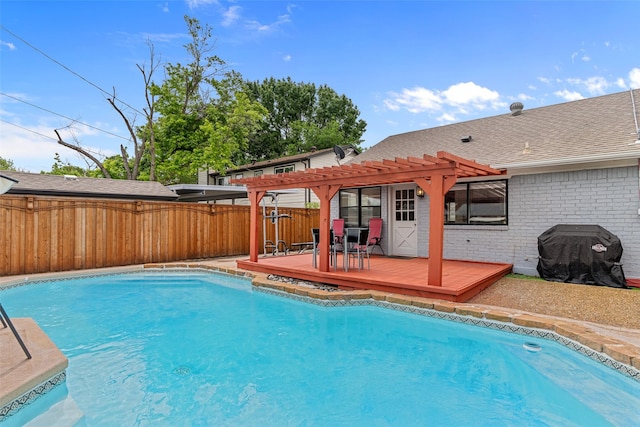 view of swimming pool with a fenced backyard, a fenced in pool, a pergola, and a deck