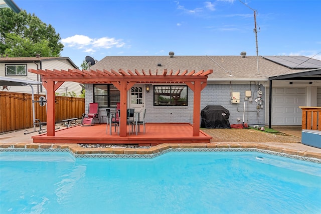 view of pool featuring a pergola, a fenced in pool, and a deck