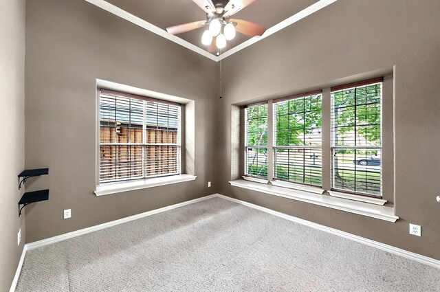 empty room with baseboards, carpet flooring, and a ceiling fan