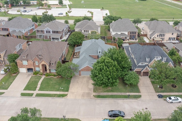 birds eye view of property with a residential view