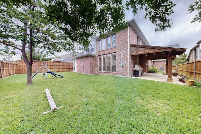 view of yard with a fenced backyard and a patio area