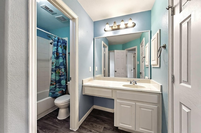 full bath with visible vents, wood finished floors, shower / bath combo, and toilet
