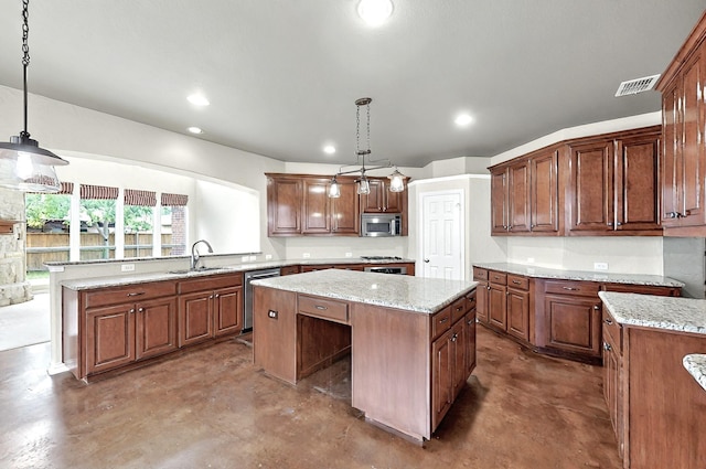 kitchen with a kitchen island, stainless steel appliances, concrete flooring, and a sink