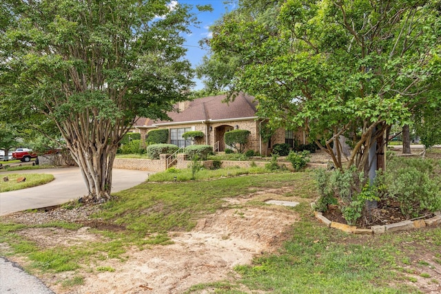 5311 Country Club Dr, Granbury, TX 76049 - view of front of house featuring concrete driveway and brick siding