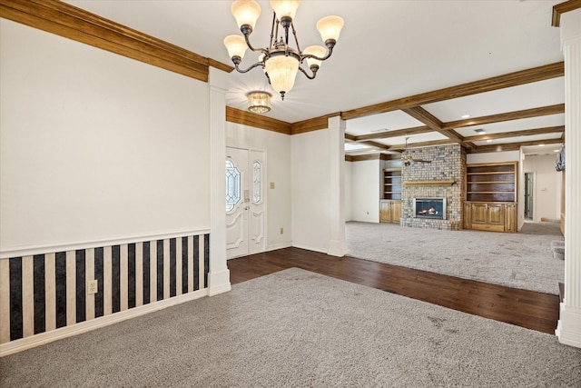 5311 Country Club Dr, Granbury, TX 76049 - unfurnished living room with carpet, a chandelier, a fireplace, wood finished floors, and beamed ceiling