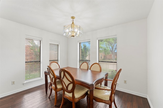dining room with baseboards, a chandelier, and a wealth of natural light