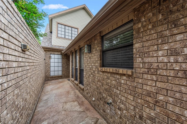 view of property exterior featuring brick siding