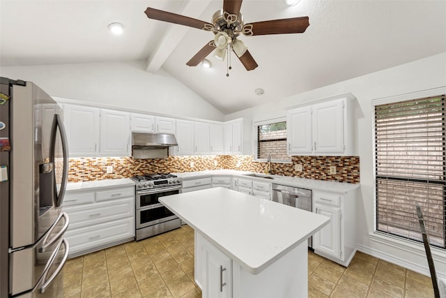 kitchen featuring light countertops, under cabinet range hood, a sink, backsplash, and stainless steel appliances
