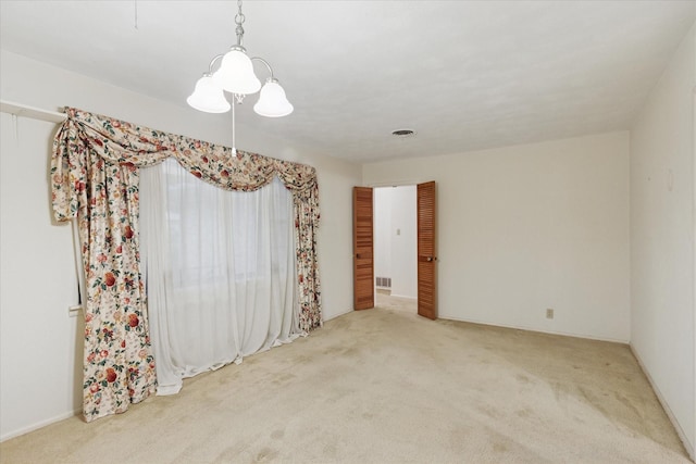 605 Clebud Dr, Euless, TX 76040 - carpeted spare room featuring a chandelier