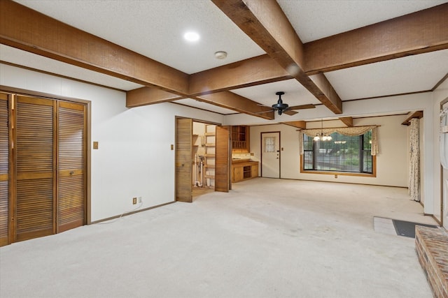 605 Clebud Dr, Euless, TX 76040 - unfurnished living room with carpet floors, a chandelier, beamed ceiling, coffered ceiling, and baseboards