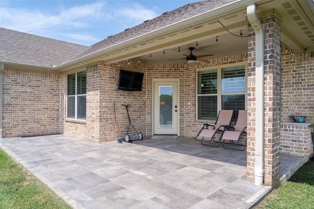 view of patio featuring ceiling fan