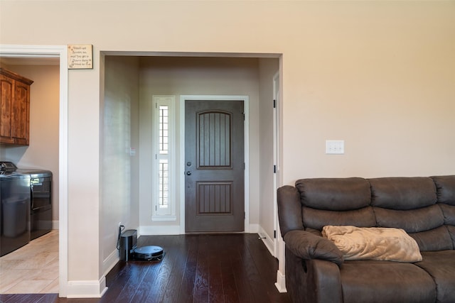 entryway featuring baseboards and hardwood / wood-style flooring