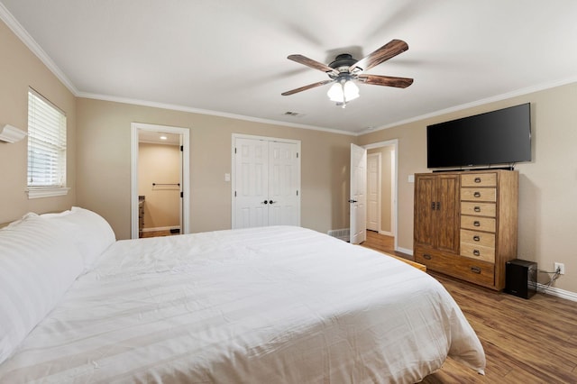 1823 E Cedar Elm Dr, Arlington, TX 76012 - bedroom featuring baseboards, ornamental molding, wood finished floors, and visible vents