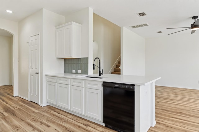 4413 Blackberry Rd, Melissa, TX 75454 - kitchen with black dishwasher, a sink, light wood-style floors, arched walkways, and recessed lighting