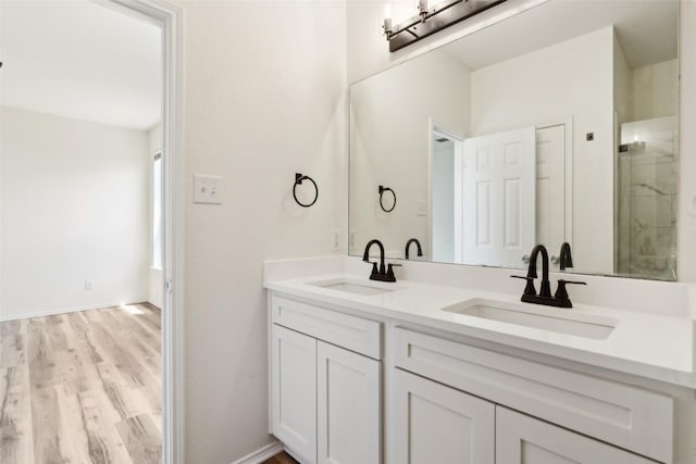 4413 Blackberry Rd, Melissa, TX 75454 - bathroom featuring wood finished floors, double vanity, and an enclosed shower