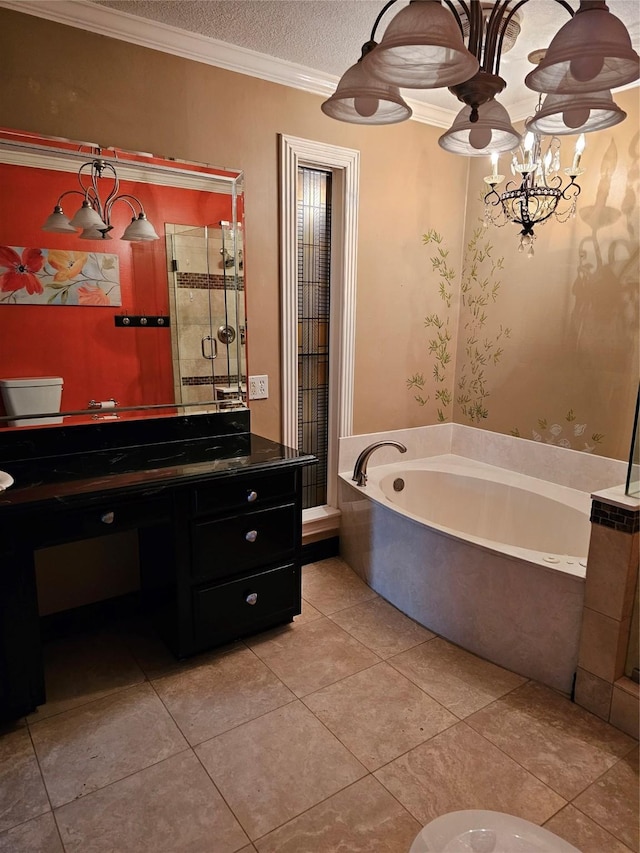 bathroom featuring a garden tub, crown molding, vanity, tile patterned floors, and a notable chandelier