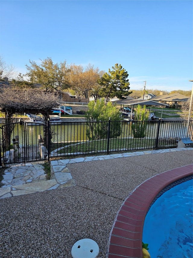 view of pool featuring fence