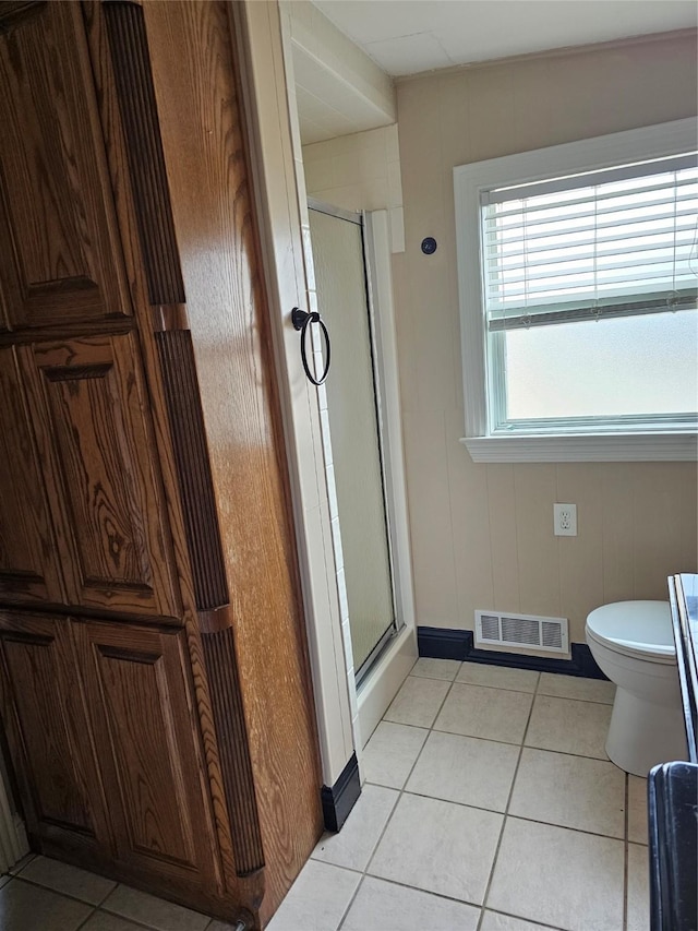 bathroom featuring visible vents, a stall shower, tile patterned floors, and toilet