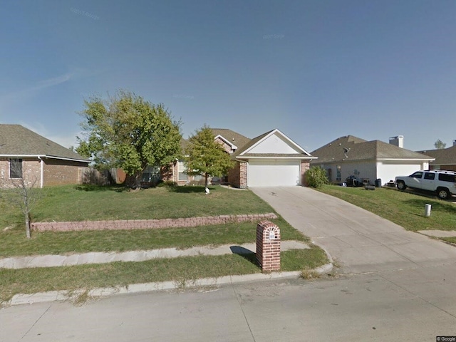 111 Chambers Creek Cir, Maypearl, TX 76064 - view of front of home with an attached garage, driveway, and a front yard