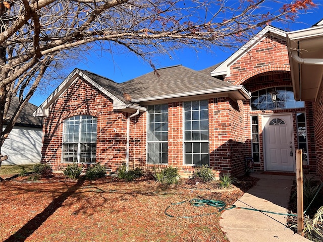 111 Chambers Creek Cir, Maypearl, TX 76064 - view of front of home featuring brick siding, roof with shingles, and a balcony