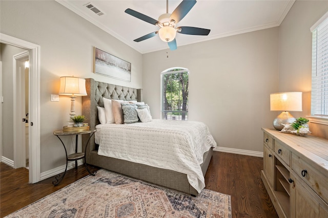 bedroom with baseboards, ornamental molding, and dark wood-type flooring