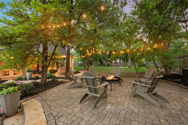 view of patio / terrace with french doors, a fenced backyard, and an outdoor fire pit