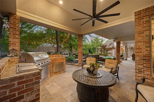 view of patio with fence, a ceiling fan, grilling area, and area for grilling