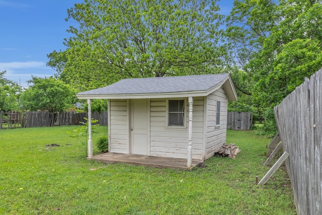 view of shed with a fenced backyard