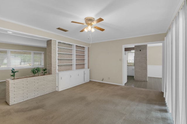 interior space featuring baseboards, light carpet, a ceiling fan, and visible vents