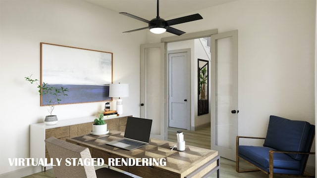 office featuring light wood-style flooring and ceiling fan
