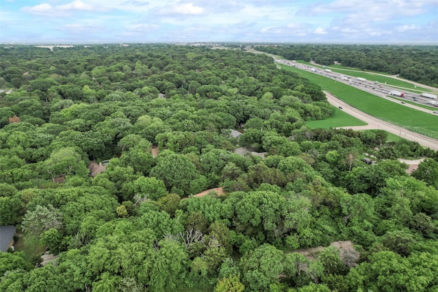 drone / aerial view featuring a view of trees