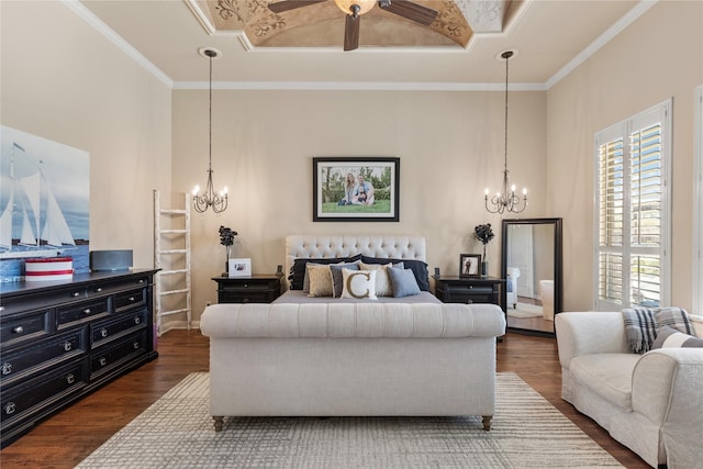 bedroom with a chandelier, dark wood-style floors, ornamental molding, and a towering ceiling