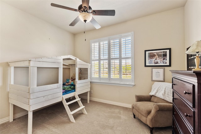 bedroom featuring baseboards, carpet, and a ceiling fan