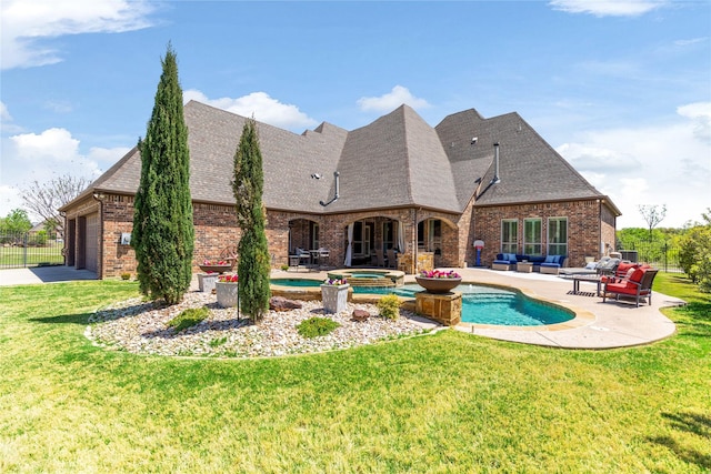 view of pool with an outdoor hangout area, a lawn, a pool with connected hot tub, and a patio area