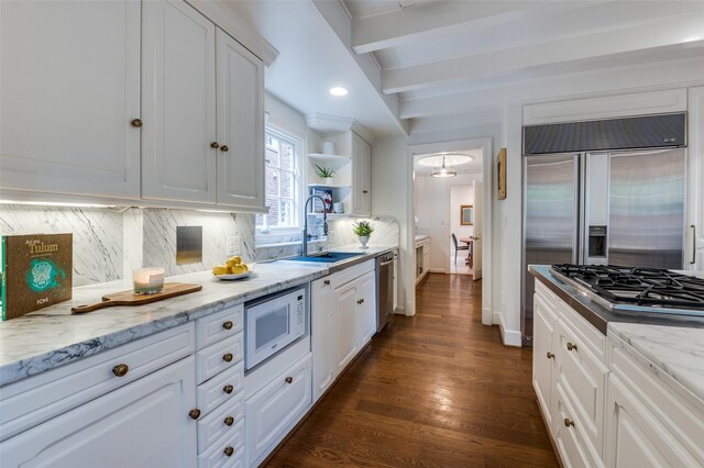 3400 Shenandoah St, University Park, TX 75205 - kitchen with built in appliances, a sink, white cabinetry, open shelves, and backsplash