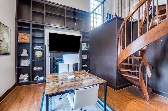 3400 Shenandoah St, University Park, TX 75205 - office area featuring a fireplace, baseboards, and wood finished floors
