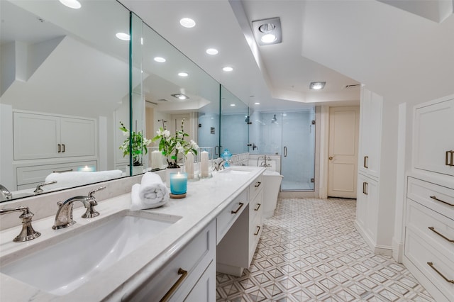 3400 Shenandoah St, University Park, TX 75205 - full bathroom featuring recessed lighting, double vanity, a stall shower, and a sink